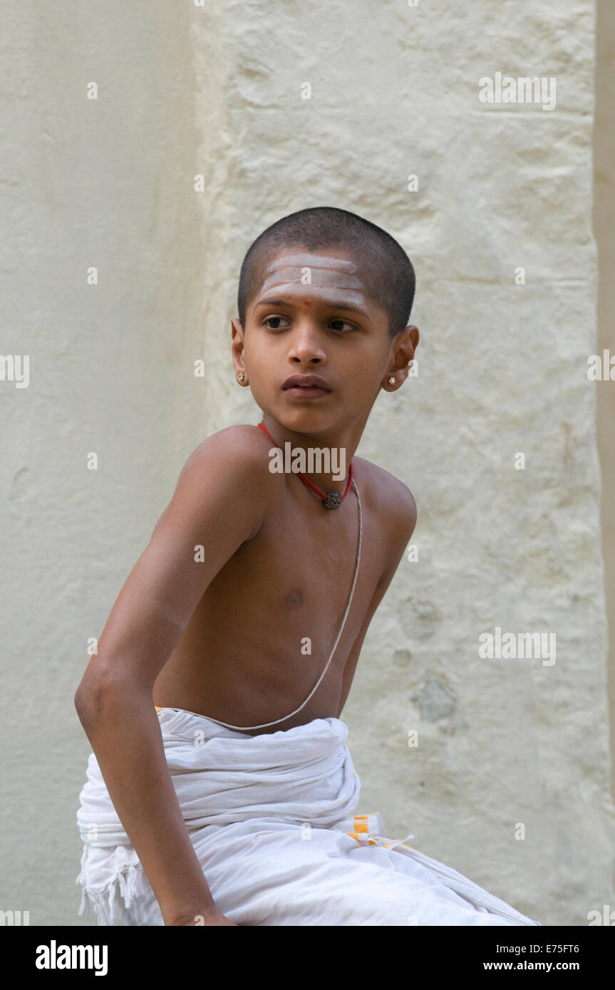 Young Indian Brahman Sanskrit boy student with sacred thread over his chest vhibuthi ash signifying aestheticism of Lord Shiva Stock Photo
