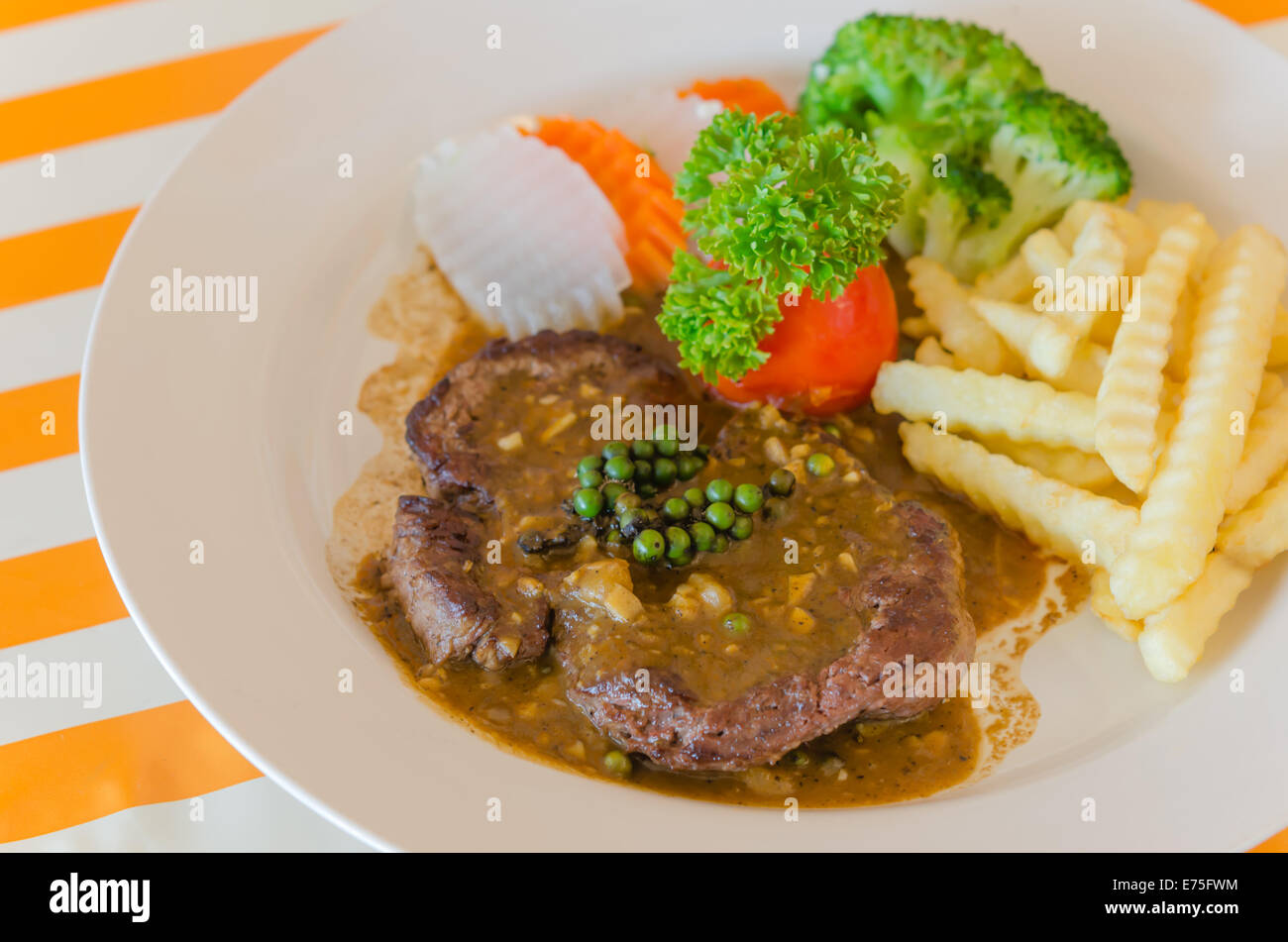 close up beef steak with green peppercorn sauce Stock Photo Alamy