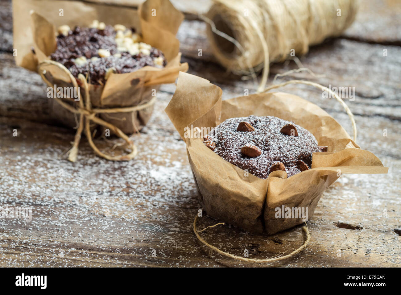 Closeup of decorating chocolate muffins with string Stock Photo - Alamy