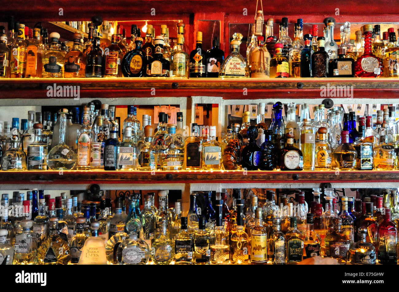 Over 200 bottles of Tequila cover  the walls of a bar in Sayulita Mexico Stock Photo
