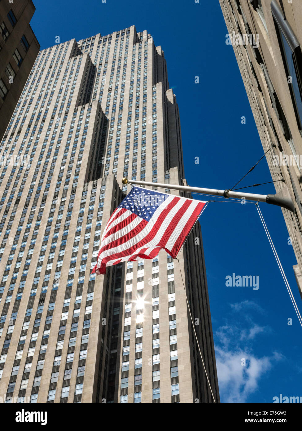 Rockefeller Center  Comcast Building, 30 Rockefeller Plaza and American Flag, NYC Stock Photo