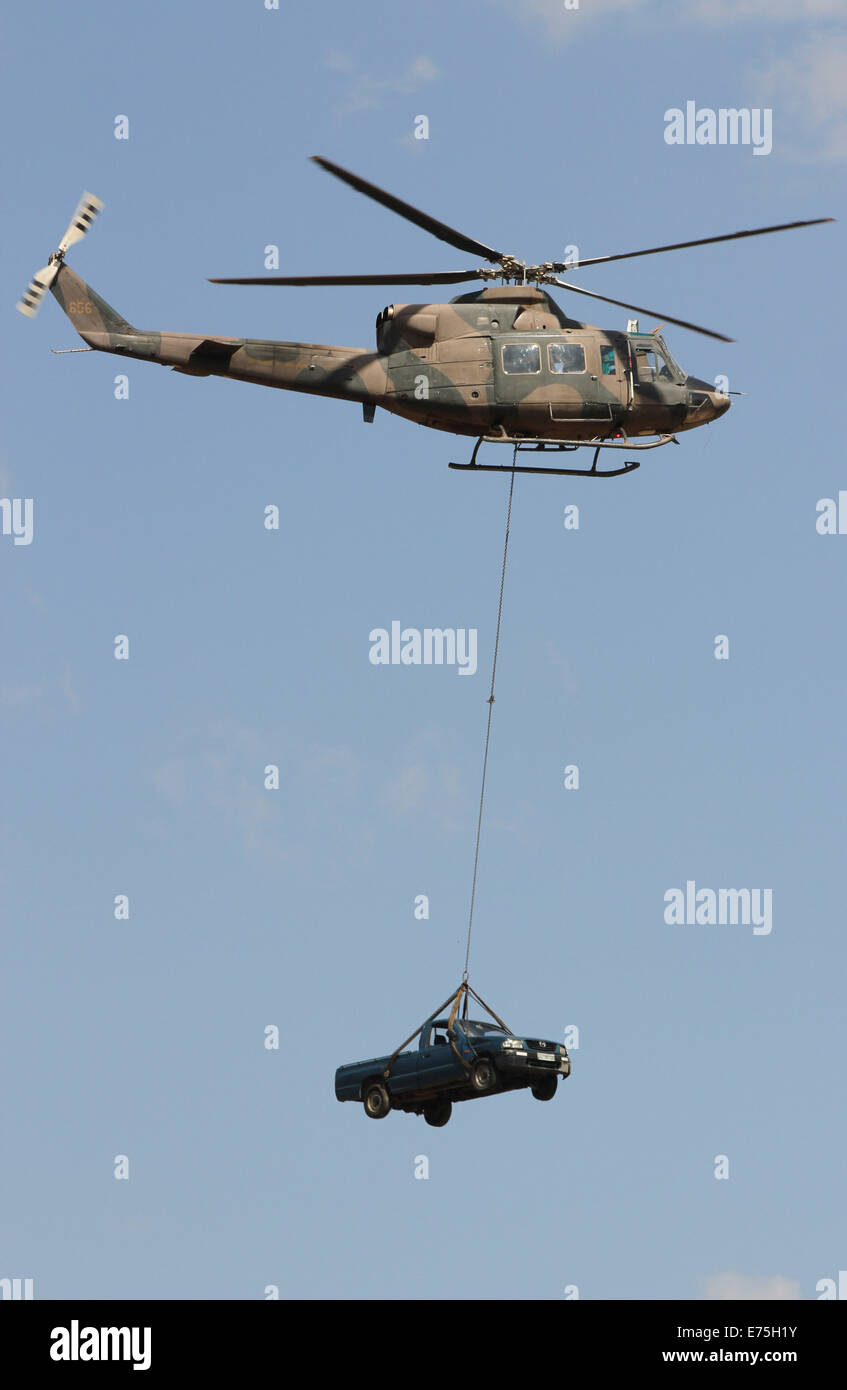 Harare. 7th Sep, 2014. A military helicopter demonstrates lifting a car