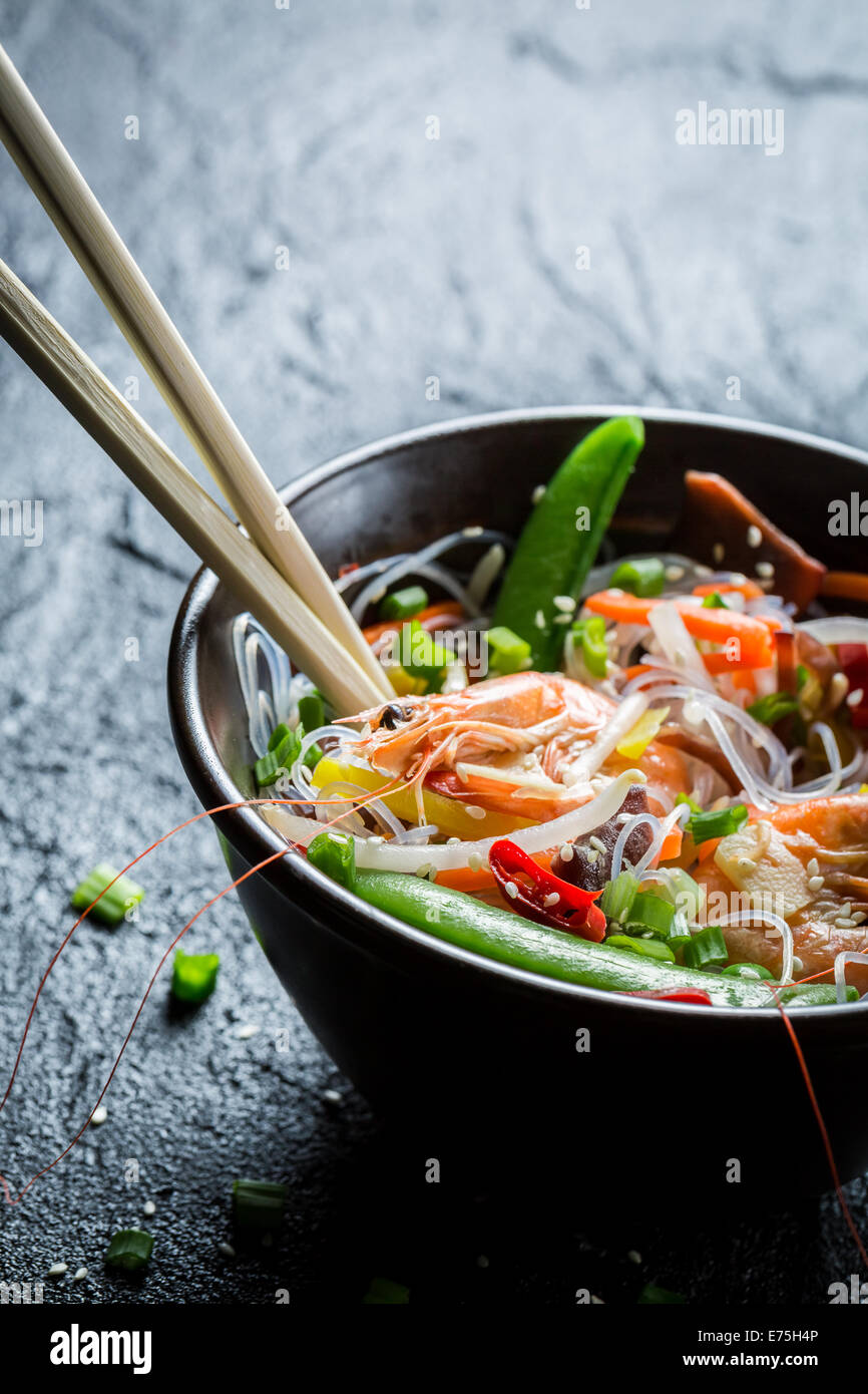 Shrimp and vegetables served with noodles Stock Photo - Alamy