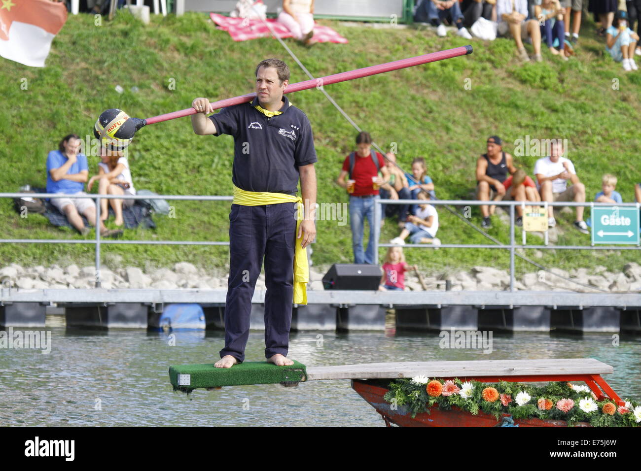 A competitor waits for the next round. Fifteen teams each consisting of 2 rowers and one man fighting with a lance, competed in the 65th anniversary Fischerstechen (Fishermen's Joust) held on the final day of the Backfischfest. © Michael Debets/Pacific Press/Alamy Live News Stock Photo
