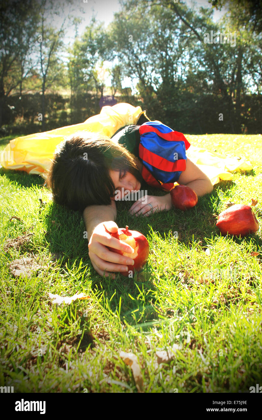 Snow white lays on the ground after eating a poison apple Stock Photo Alamy