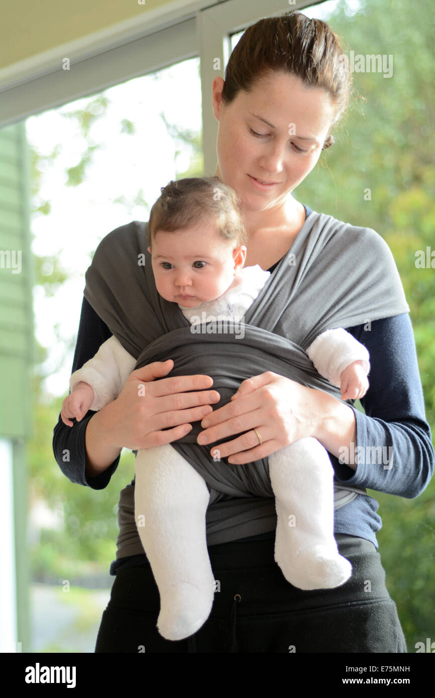 newborn in sling wrap