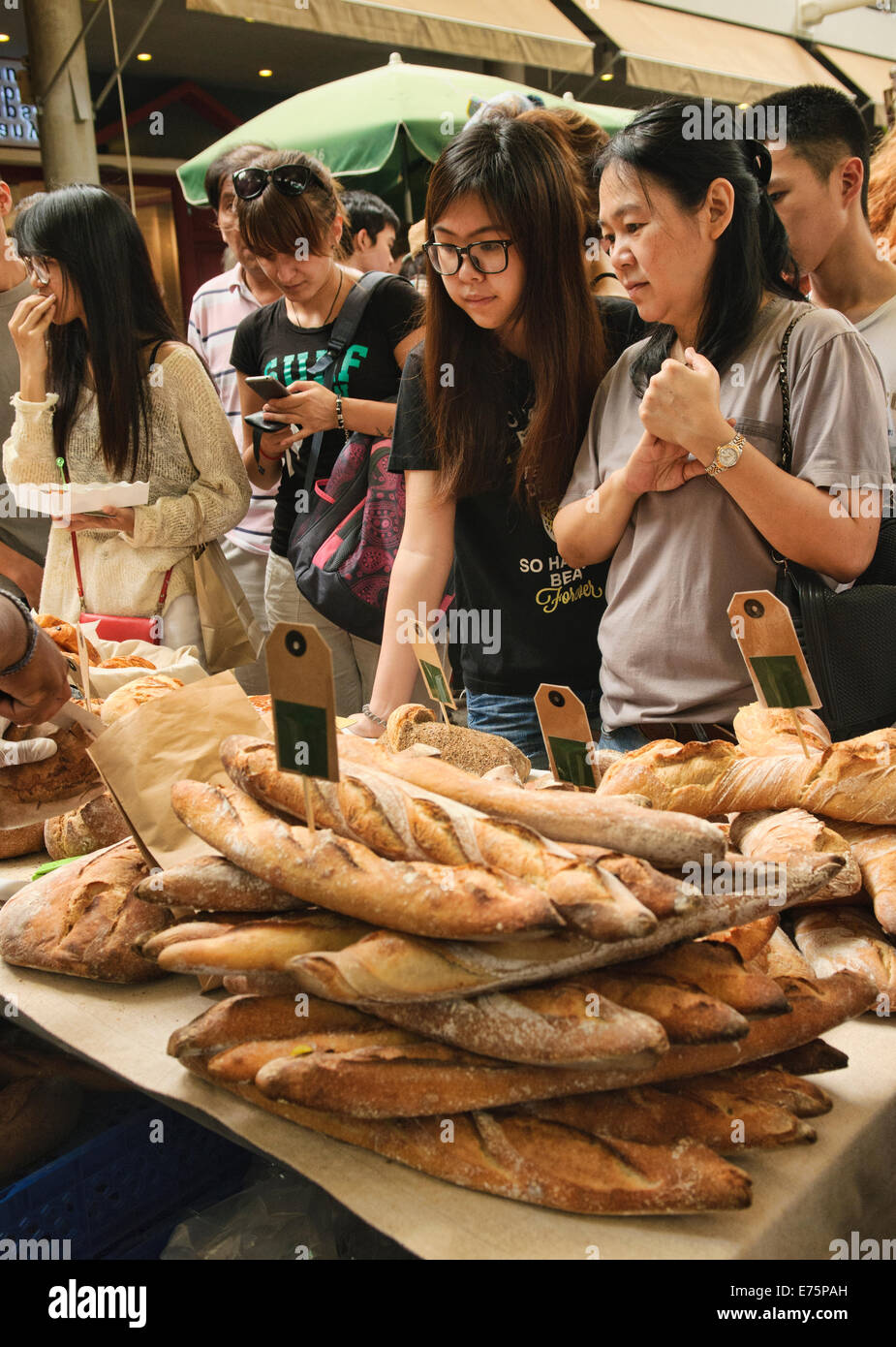 Buying bread at the Farmers Market, Bangkok, Thailand Stock Photo
