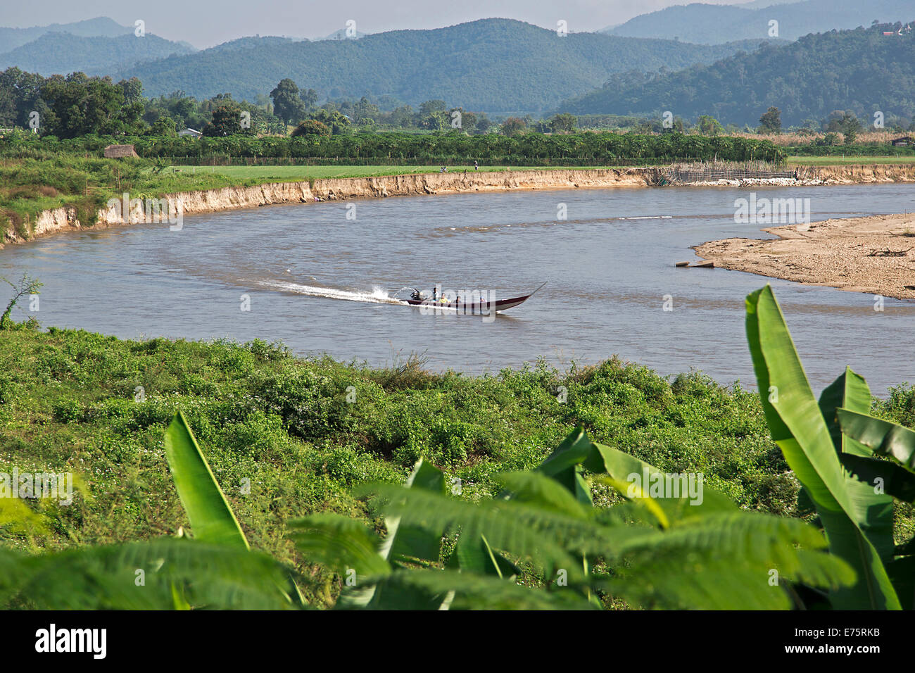 Longtail boat on the Maenam Kok River, near Mae Ai, Province of Chiang Rai, Thailand Stock Photo
