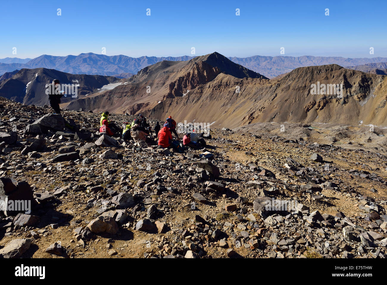 Group of hikers resting on the way to Alam Kuh, 4848m, Kelardasht, Takht-e Suleyman Massif, Alborz Mountains Stock Photo