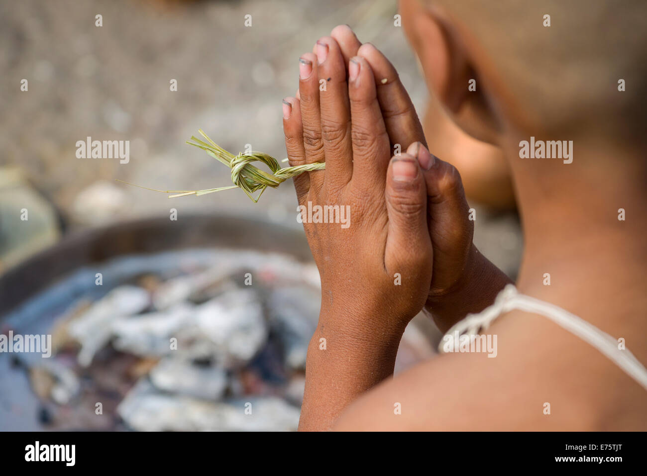 A man is praying during Dashkriya or Asthi Visarjan, a ritual which is ...