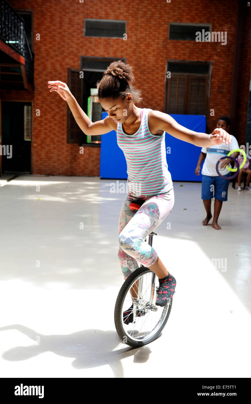 Girl, 13 years, riding a unicycle training for a circus performance