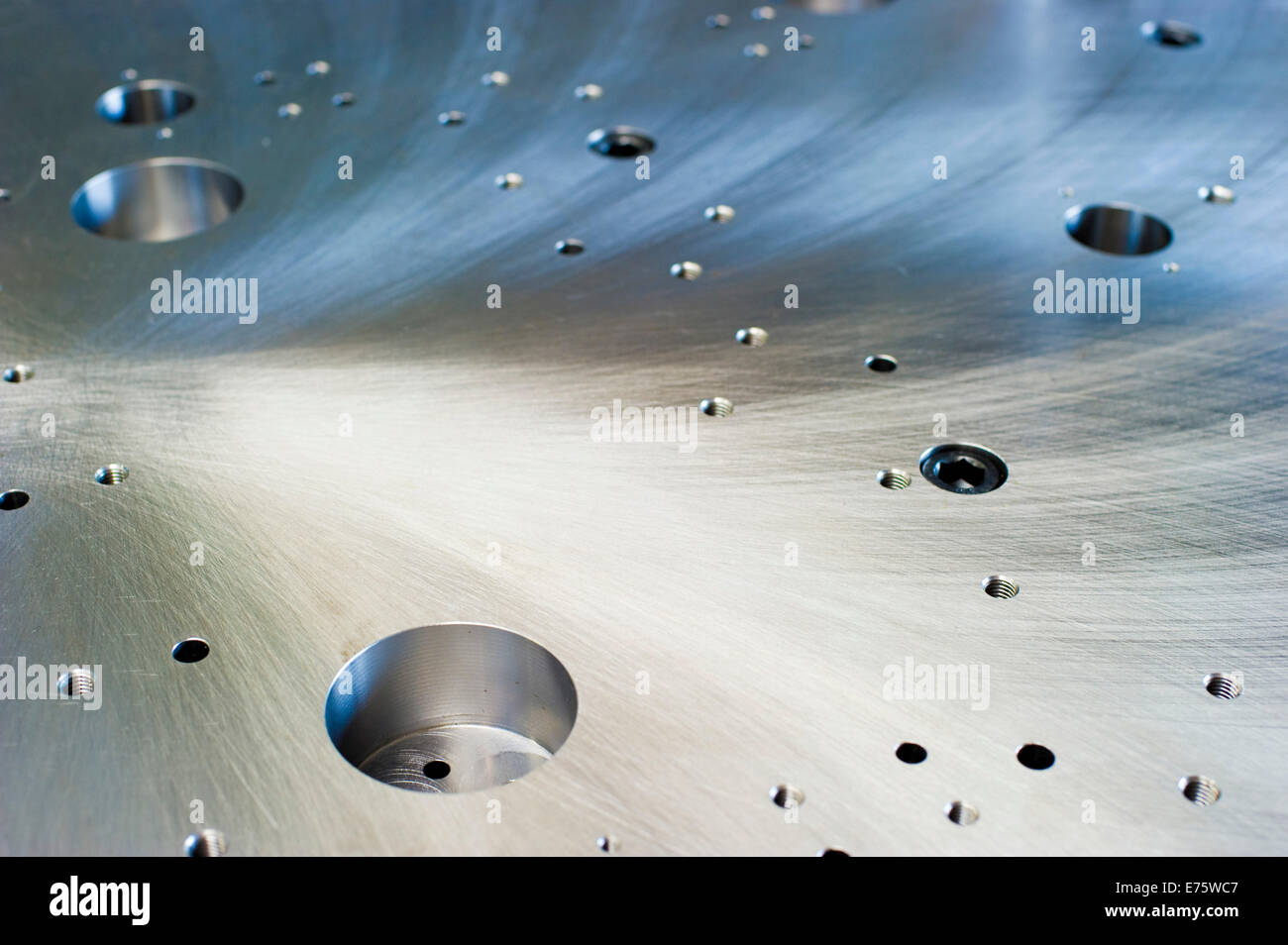Cut metal surface with drilled holes Stock Photo