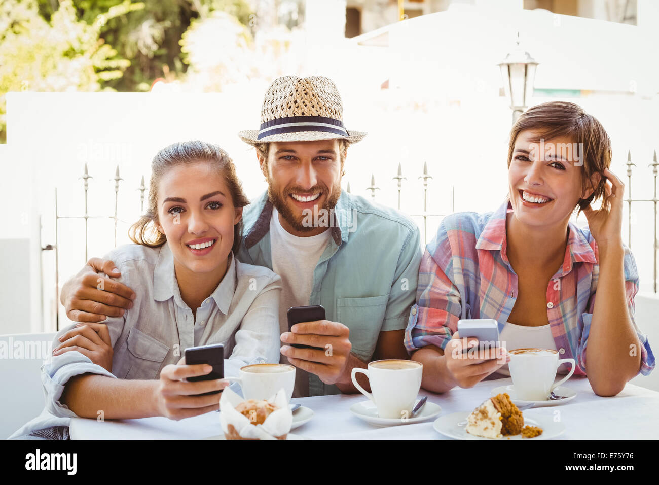 Happy Friends Enjoying Coffee Together Stock Photo - Alamy