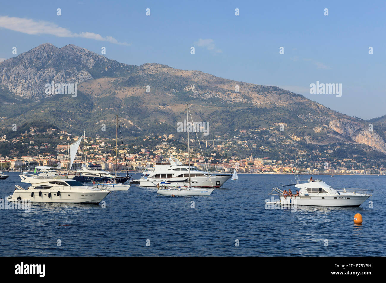 Motor yachts and sailboats moored off the coast of Roquebrune-Cap-Martin, Menton, Provence-Alpes-Côte d&#39;Azur, France Stock Photo