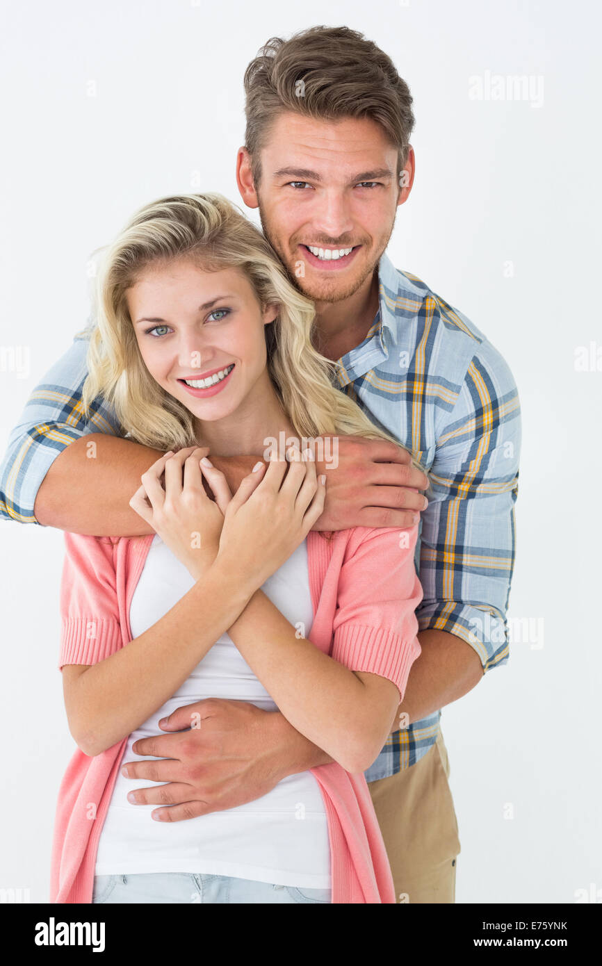 Young man embracing woman from behind Stock Photo - Alamy