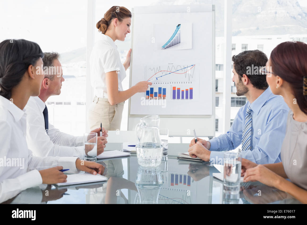 Business woman giving a presentation Stock Photo