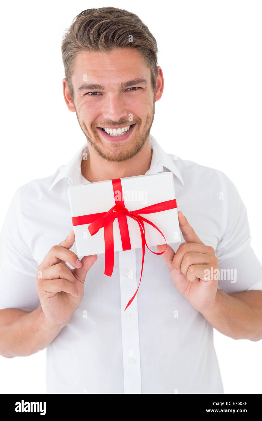 Man Getting Gift Portrait of smiling young man holding gift Stock Photo - Alamy