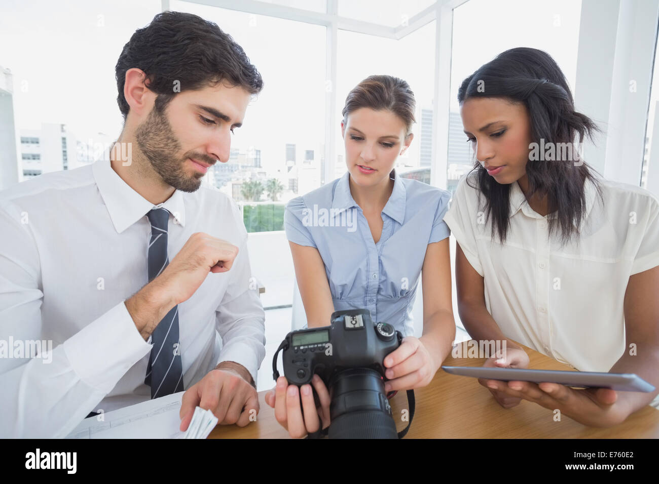 Business people using a camera Stock Photo - Alamy