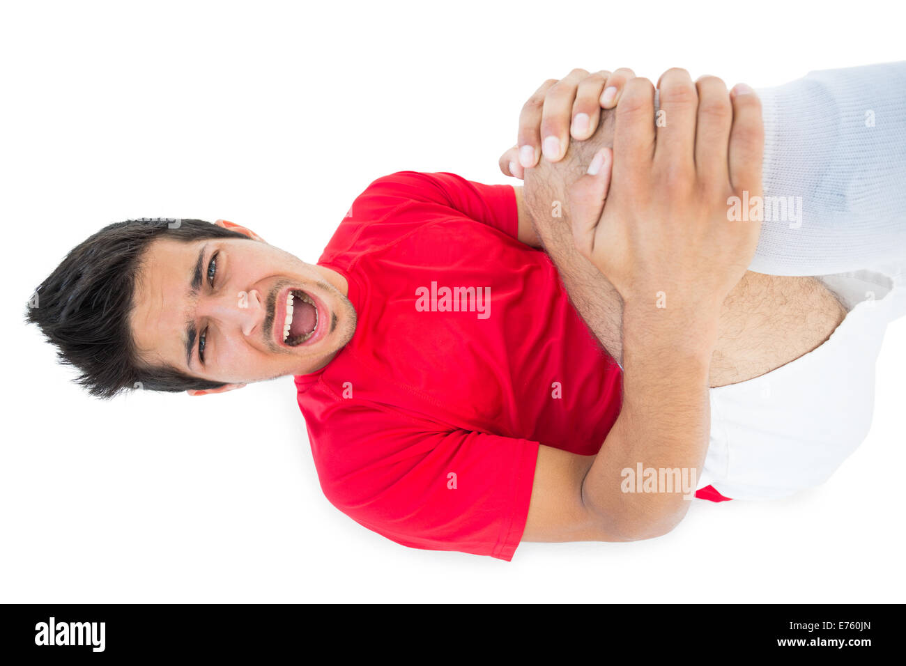 Soccer player lying down and shouting in pain Stock Photo Alamy