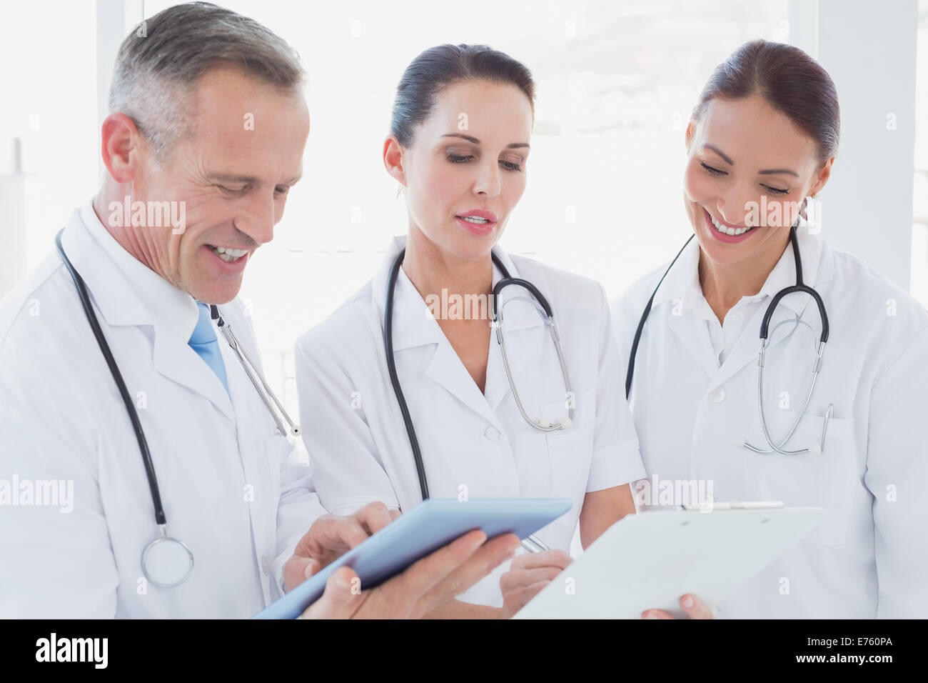 Doctors standing beside each other Stock Photo - Alamy