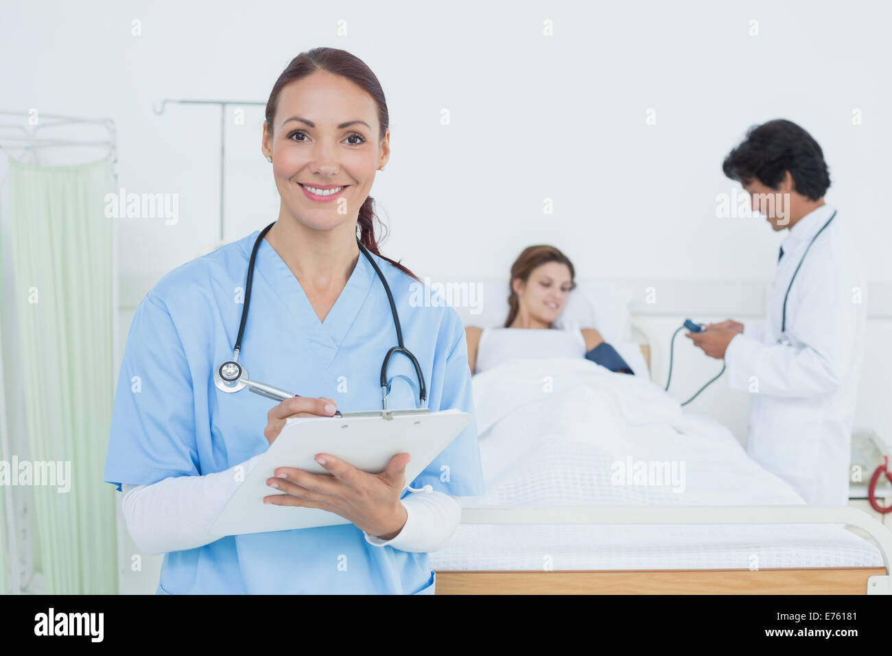 Nurse looking at the camera Stock Photo - Alamy