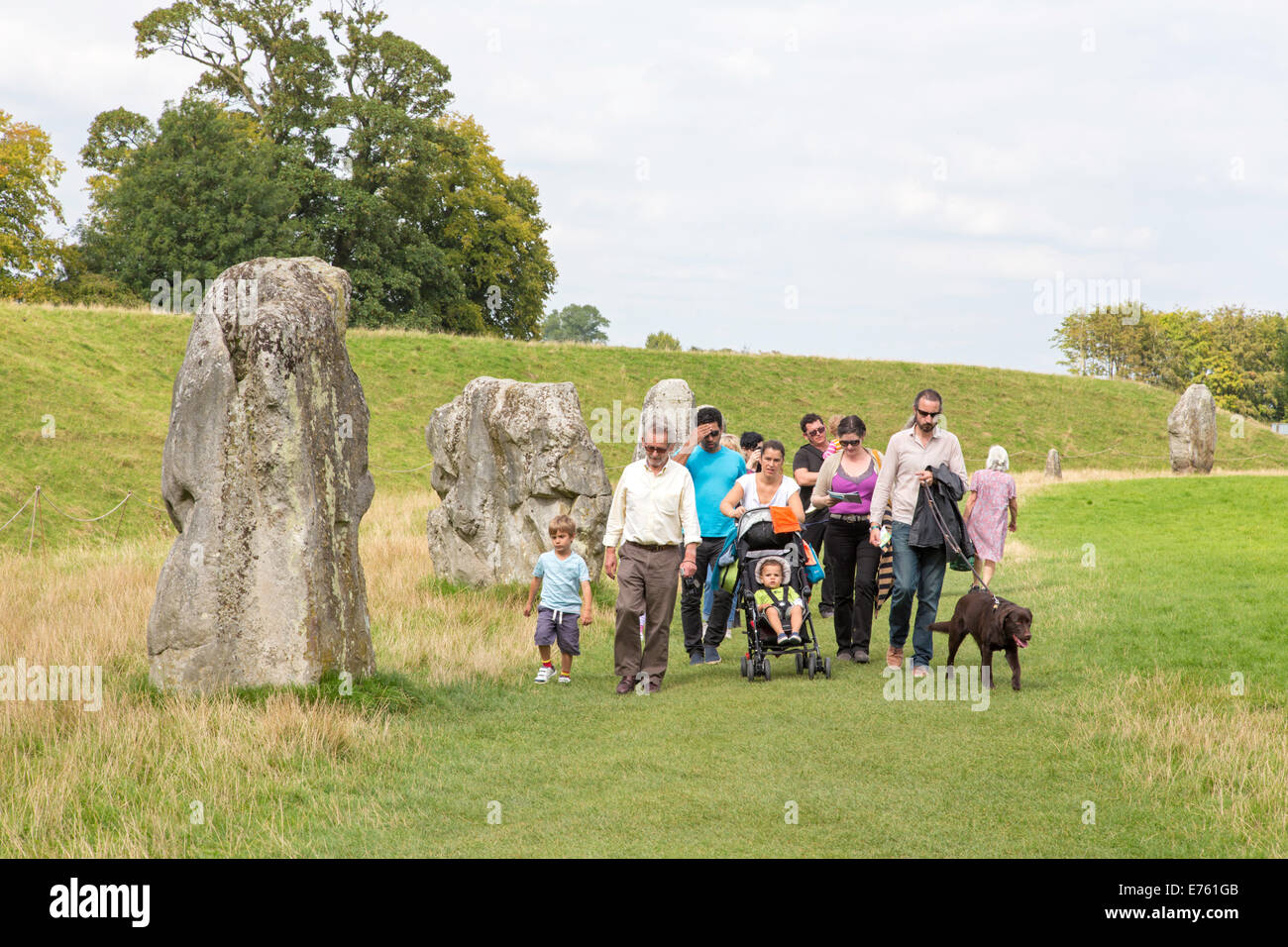 Families on day out at Avebury Neolithic Stone Circle, Avebury near Marlborough, Wiltshire, England, UK Stock Photo