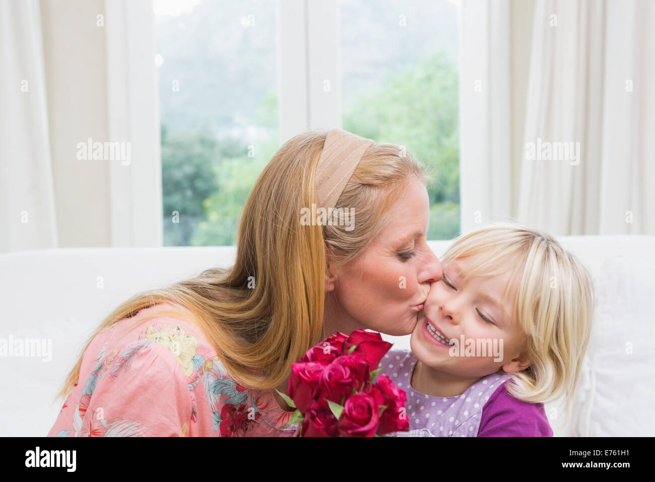 Woman and daughter roses hi-res stock photography and images - Alamy
