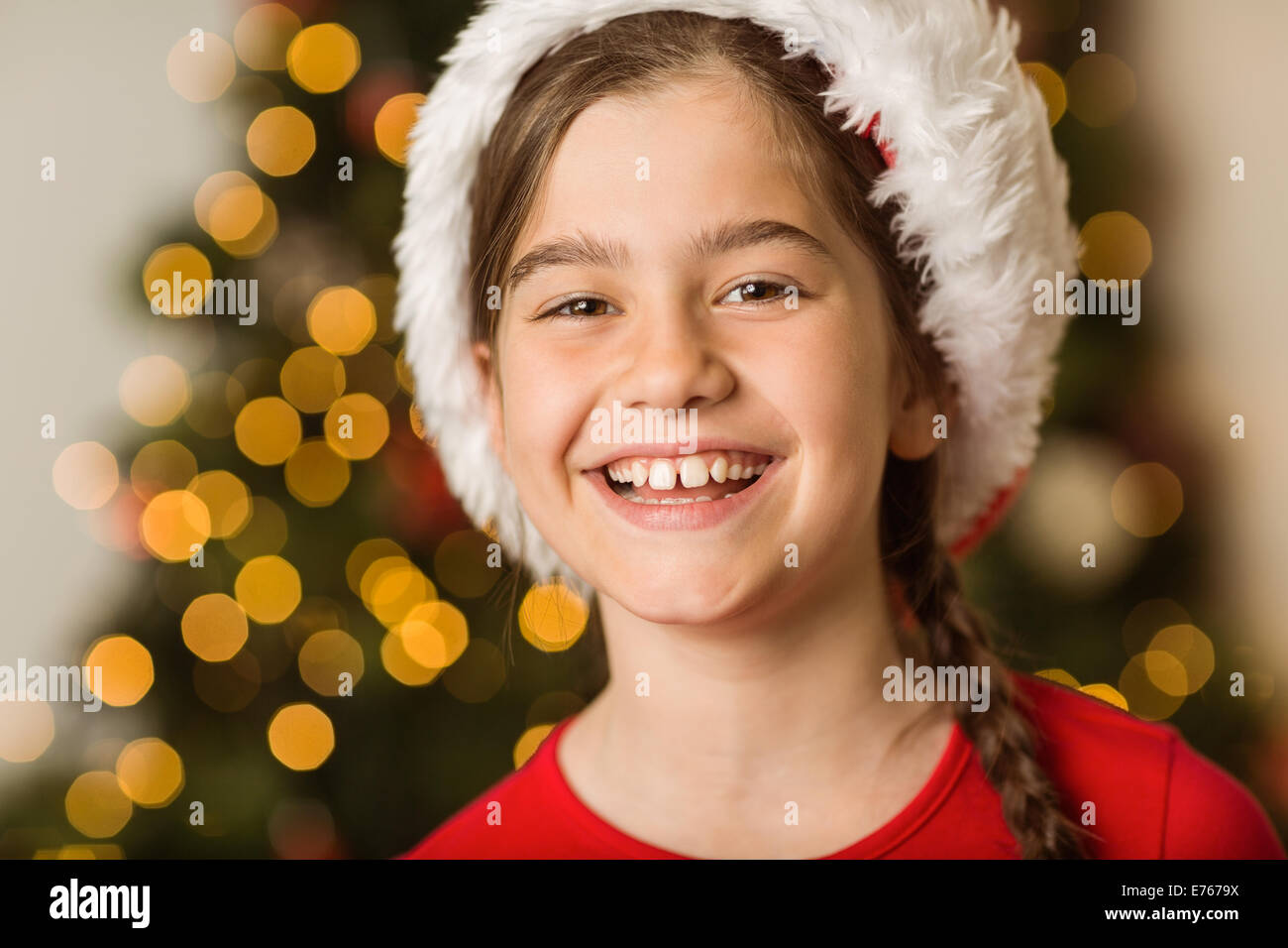 Festive little girl smiling at camera Stock Photo - Alamy
