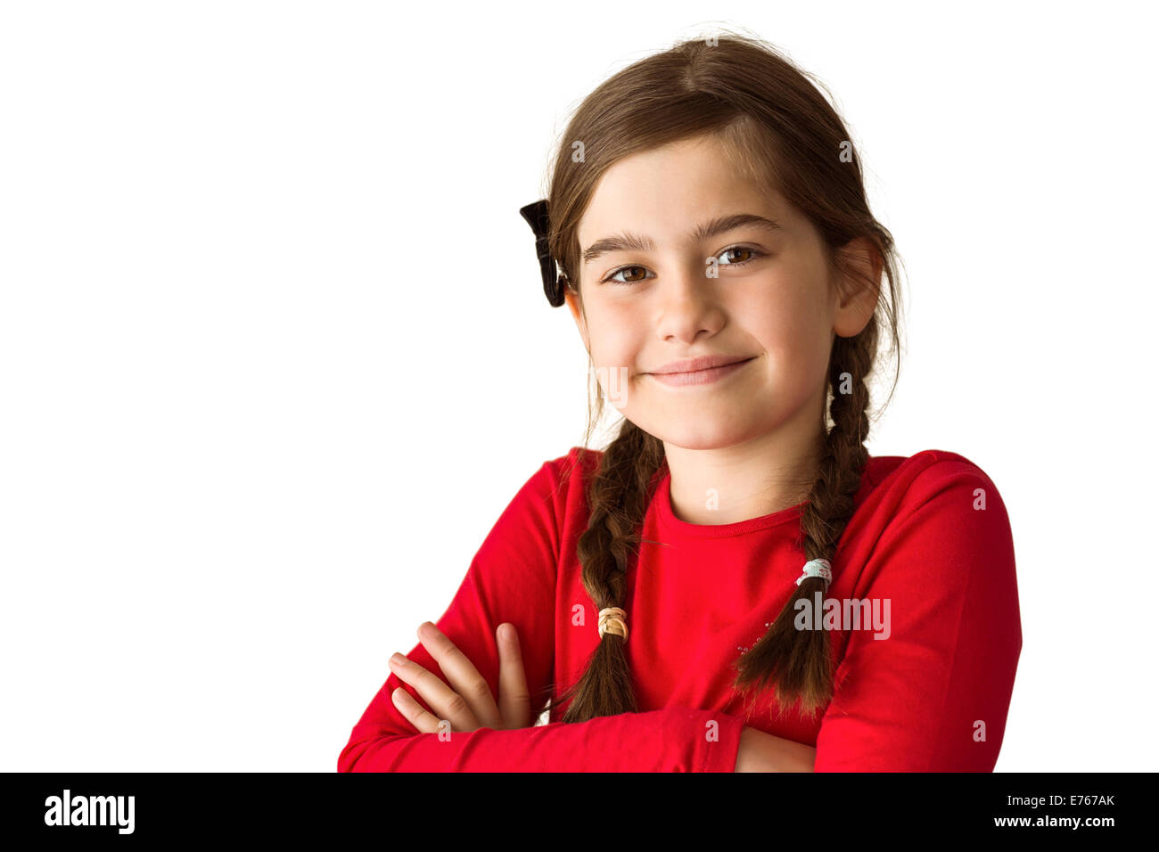 Cute little girl smiling at camera Stock Photo - Alamy