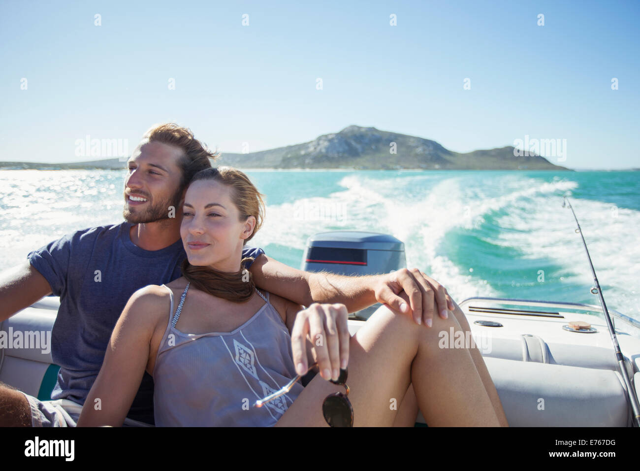 Young couple on motor boat hi-res stock photography and images image photo
