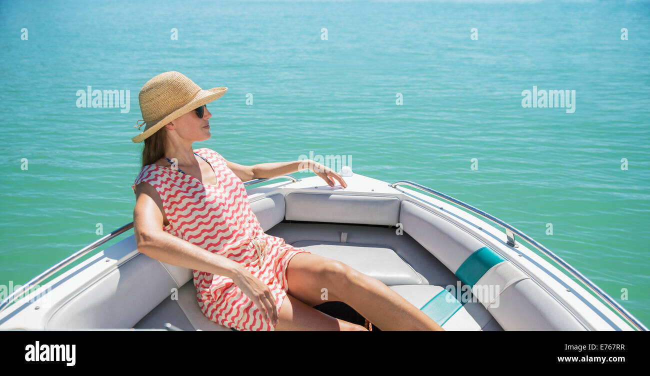 Women relaxing in boat on water Stock Photo