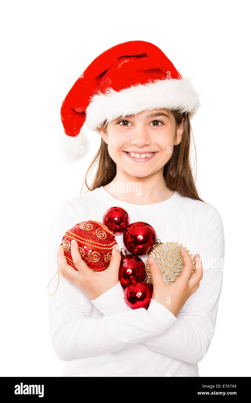 Festive little girl smiling at camera holding baubles Stock Photo - Alamy