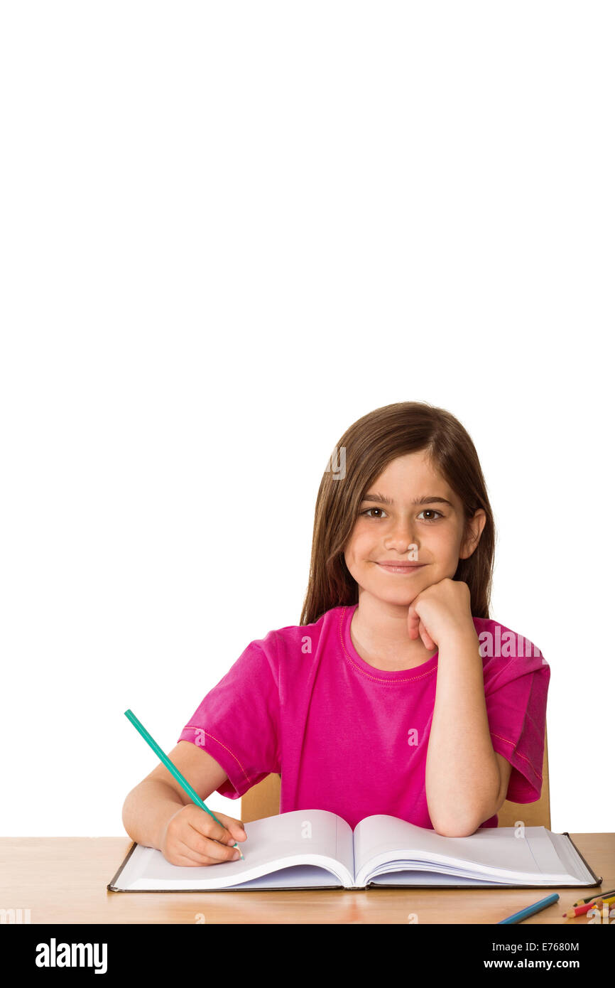 Cute pupil working at her desk Stock Photo - Alamy