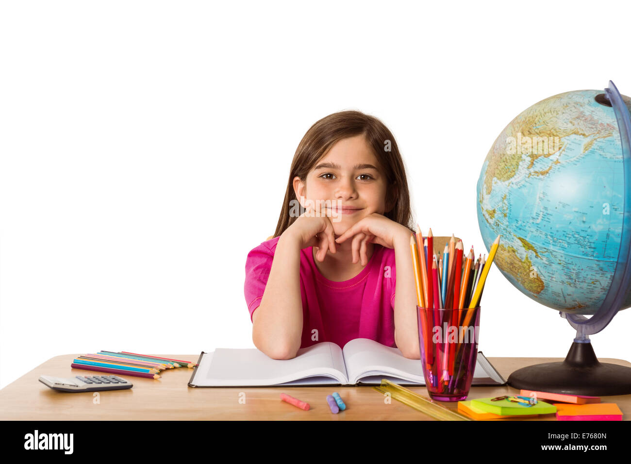 Cute pupil working at her desk Stock Photo - Alamy