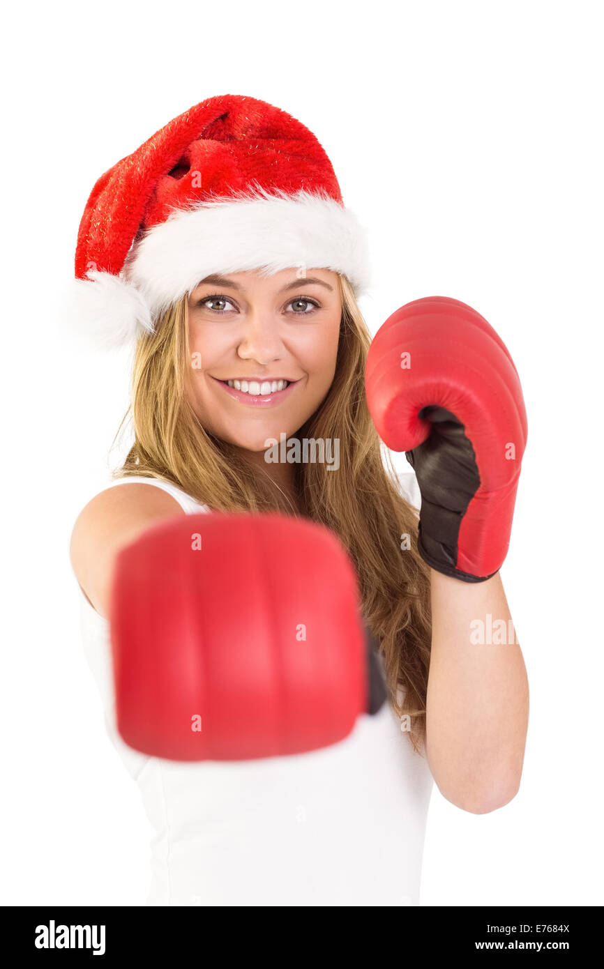 Festive blonde punching with boxing gloves Stock Photo Alamy