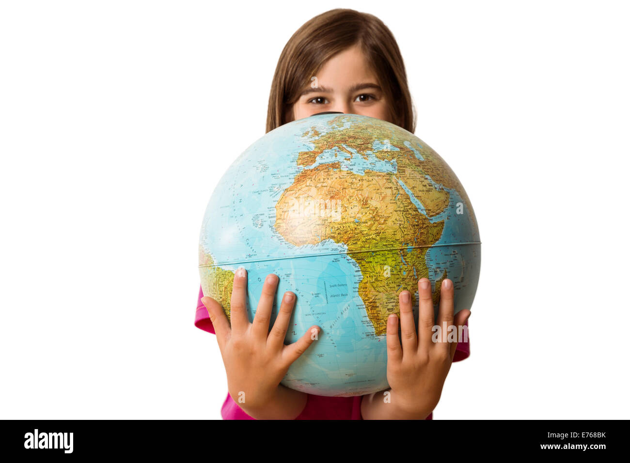 Cute pupil smiling holding globe Stock Photo - Alamy