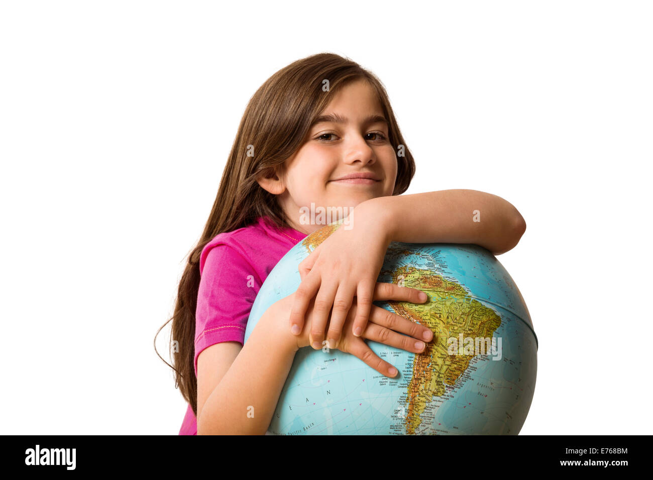 Cute pupil smiling holding globe Stock Photo - Alamy