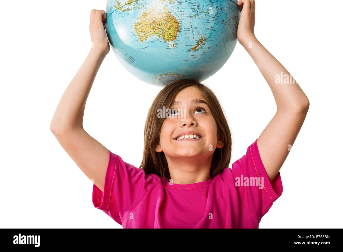 Cute pupil smiling holding globe Stock Photo - Alamy