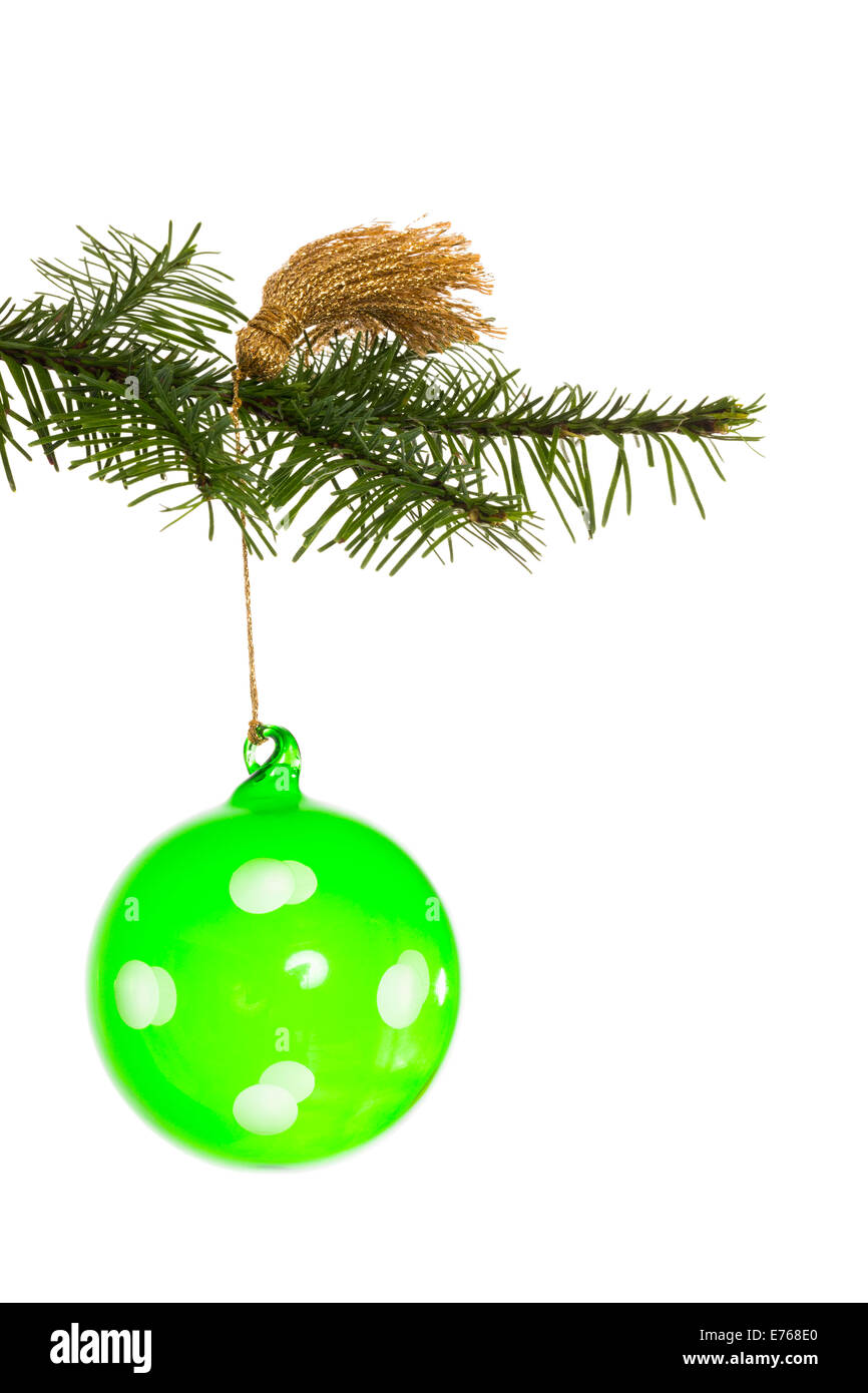 Green christmas decoration hanging from branch Stock Photo