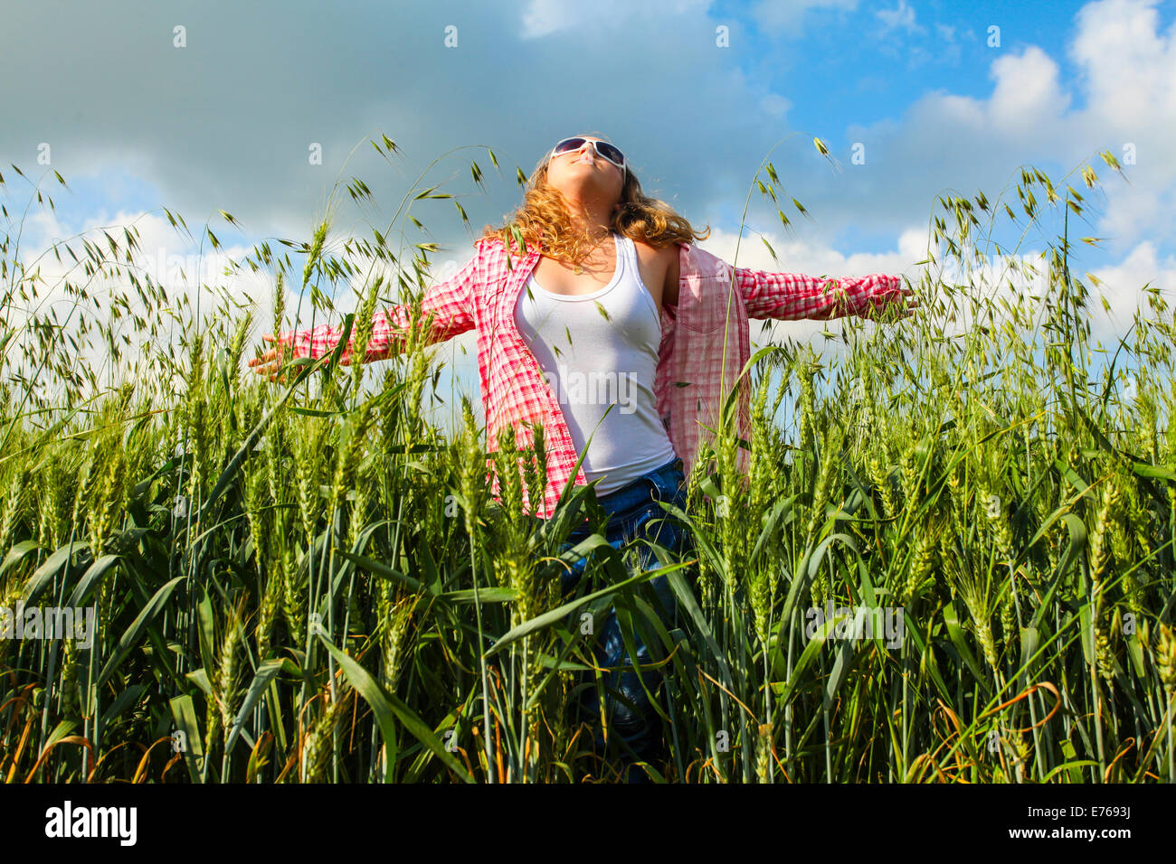 Portrait of a 16 year old teen girl in a wheat field Model released Stock Photo