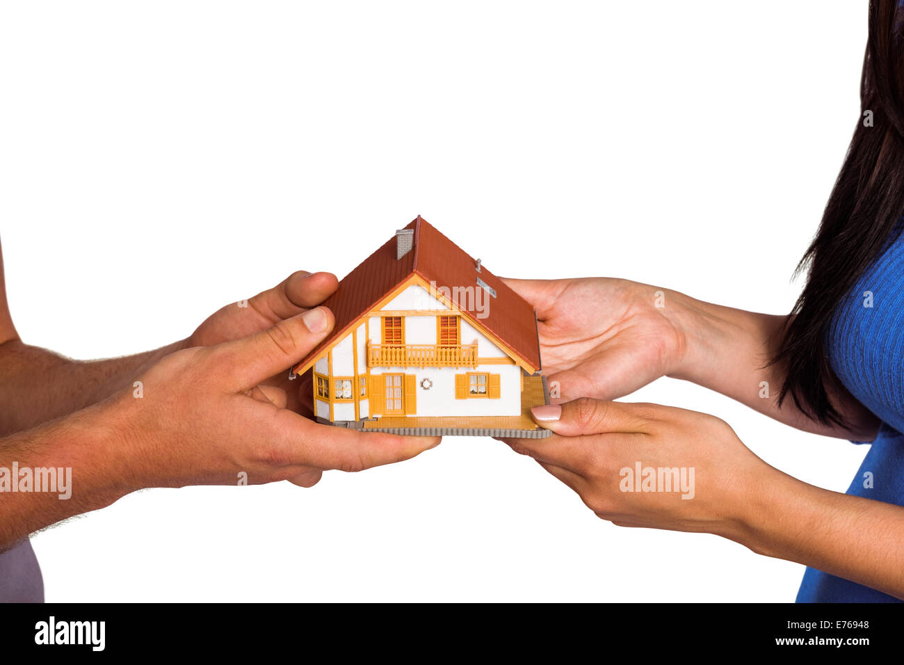 Young couple holding a model house Stock Photo - Alamy