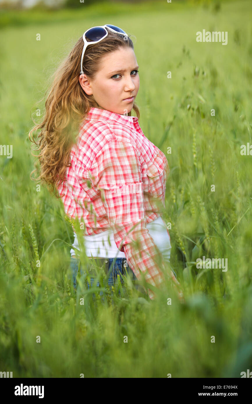 Portrait of a 16 year old teen girl in a wheat field Model released Stock Photo