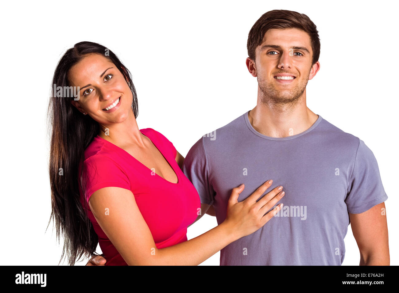 Young couple smiling at the camera Stock Photo - Alamy