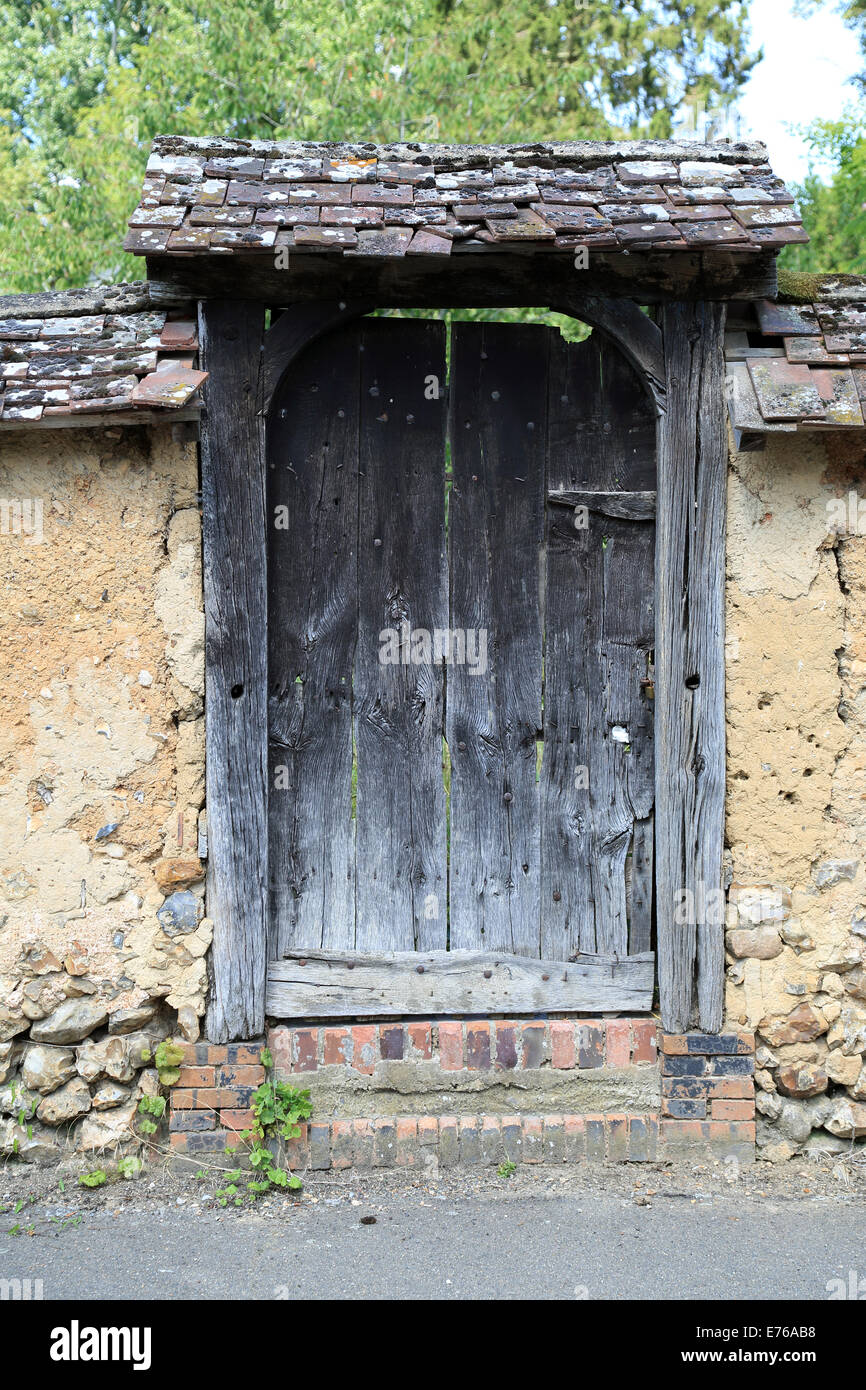 Door in wall to garden in Rue de la Fontaine, Illiers Combray, Centre, Eure et Loir, France Stock Photo