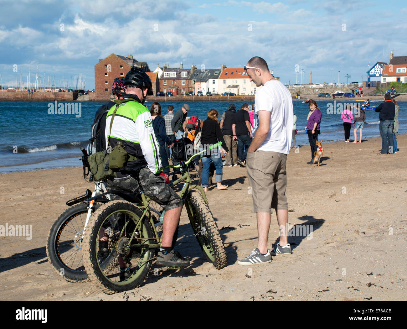 Super big bike tyres help to cycle on the sandy beach at North Berwick. Stock Photo