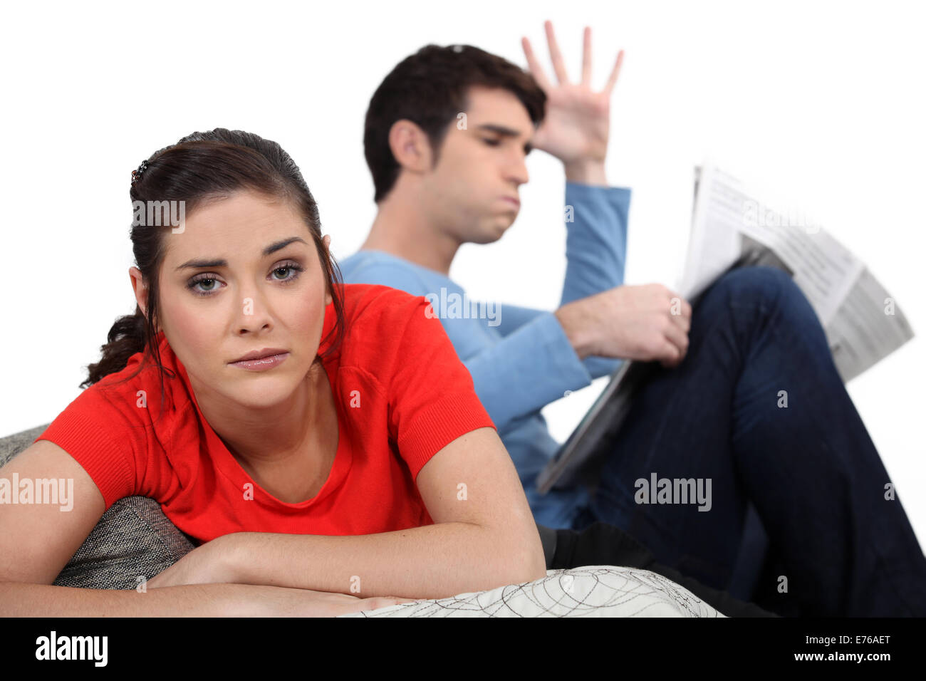 Couple having argument on sofa Stock Photo - Alamy