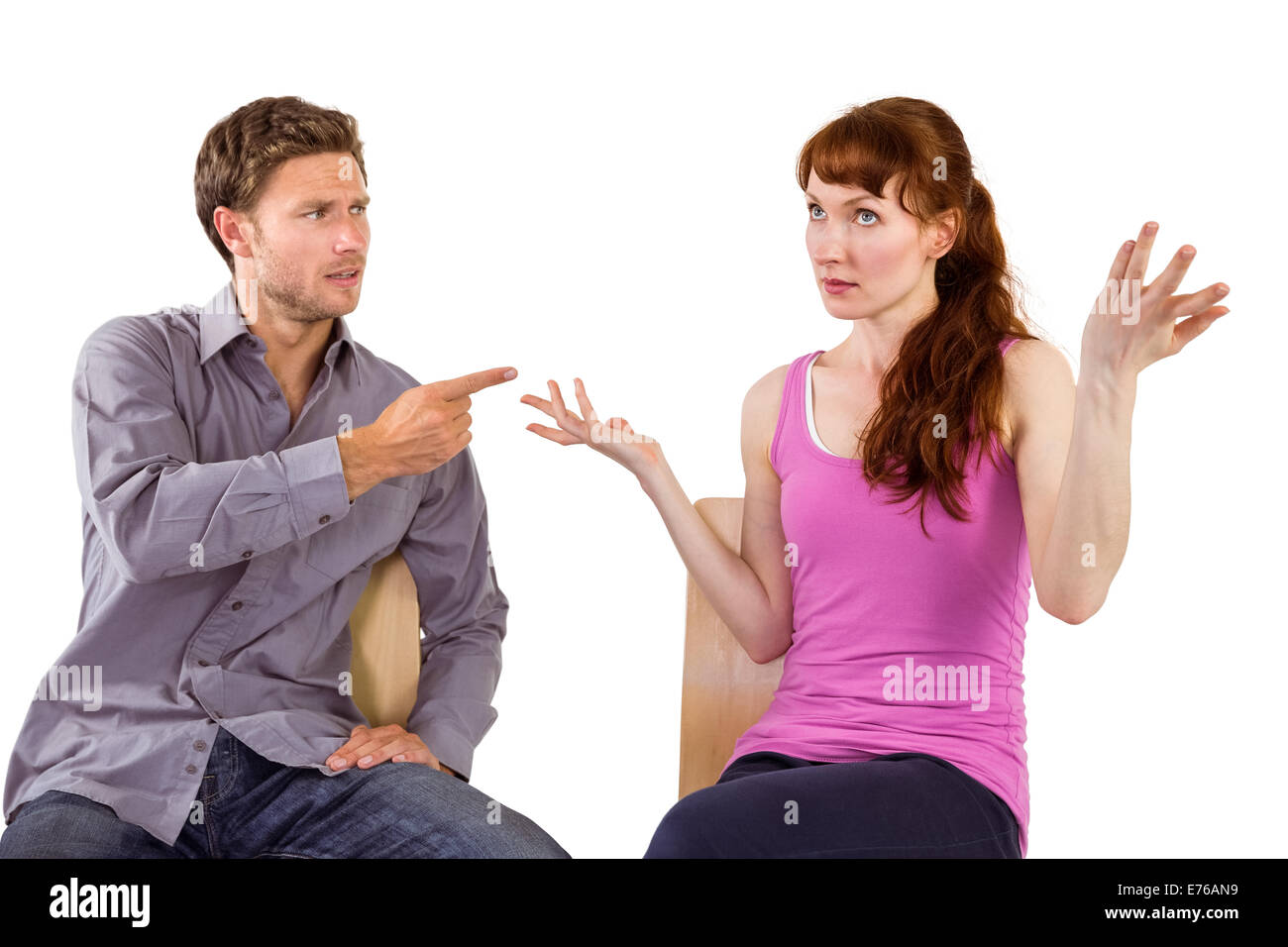 Sitting couple having an argument Stock Photo - Alamy