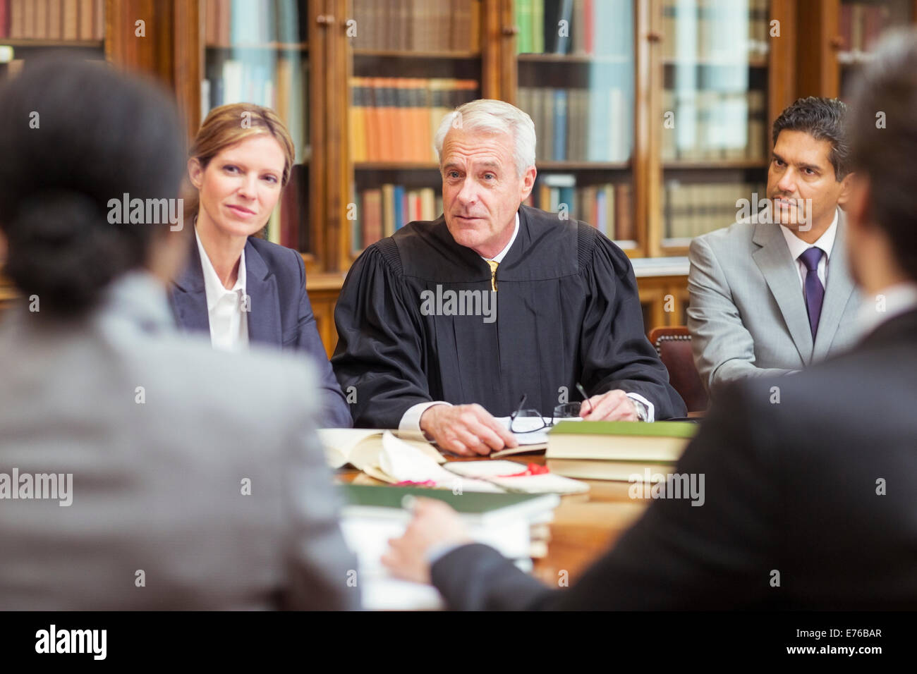 Judge talking with lawyers in chambers Stock Photo