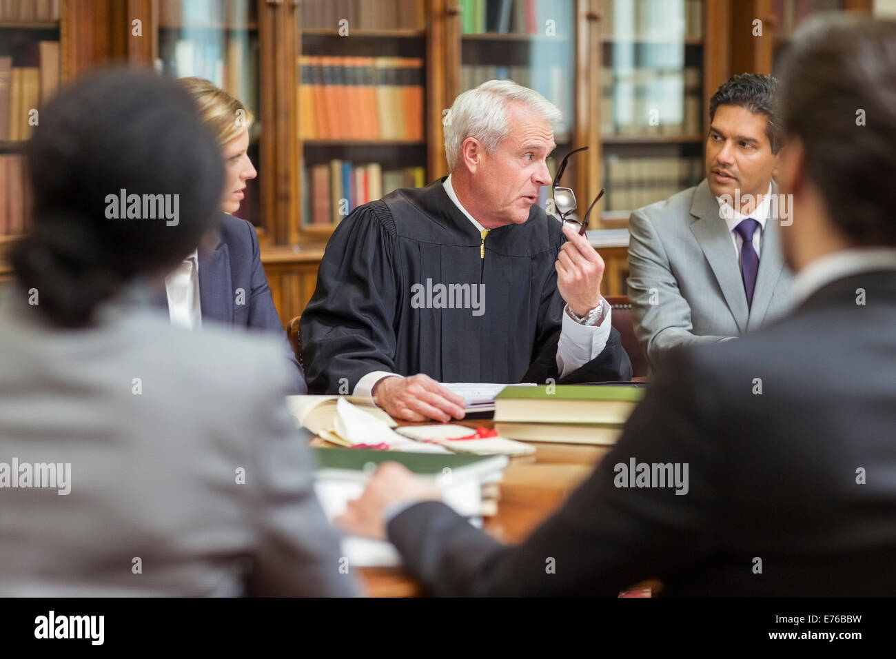 Judge and lawyers talking in chambers Stock Photo