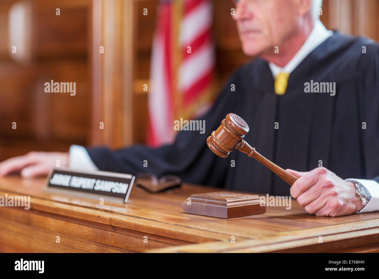 Judge banging gavel in court Stock Photo